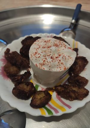 A picture of Fried banana with Vanilla icecream.