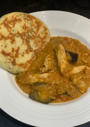A picture of Red lentil chicken curry with aubergine and home-made naan bread for Jamo.