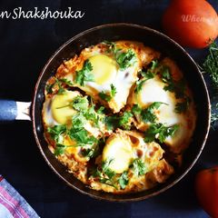 A picture of Moroccan Shakshouka Egg Poached in Tomato Sauce.