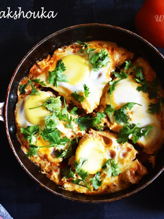 A picture of Moroccan Shakshouka Egg Poached in Tomato Sauce.