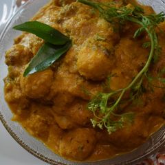 A picture of Mutkale - Rice Balls in red hot sauce with mutton.