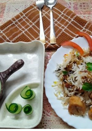 A picture of Awadhi biryani layered with soya chaap.
