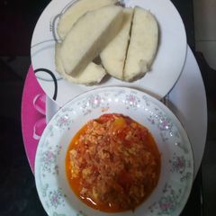 A picture of Yam with egg and tomato sauce.