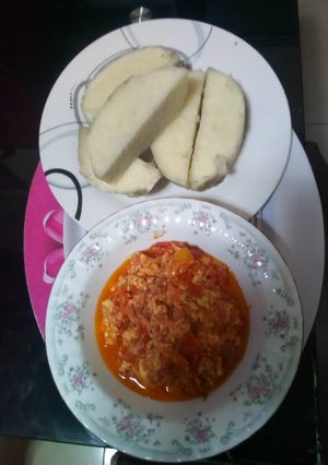 A picture of Yam with egg and tomato sauce.