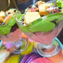 A picture of 3 layered ice-cream dessert.