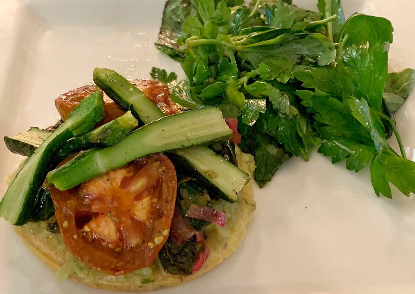 Mediterranean vegetable tart with Cavolo nero, smoky eggplant and a herb and herbs salad