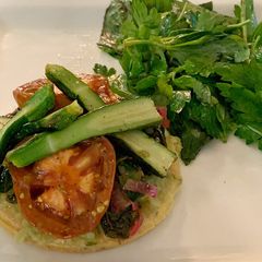A picture of Mediterranean vegetable tart with Cavolo nero, smoky eggplant and a herb and herbs salad.
