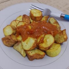 A picture of Fried potatoes and stew.