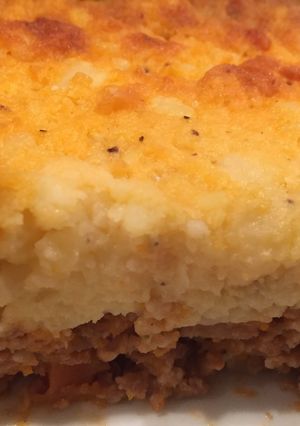 A picture of Cottage Pies with cheesy potato topping.