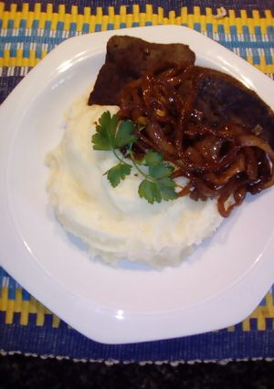 A picture of Ox Liver severed with Whipped buttery Mashed Potatoes.