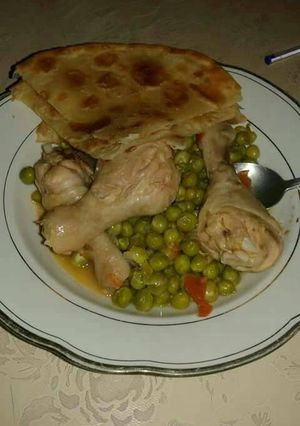 A picture of Chicken stew and peas.