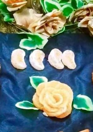 A picture of Orange cup cakes with orange flowers decorate.