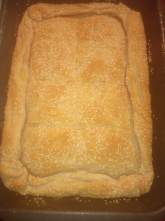 A picture of Cheese Pie with Cream, Yogurt, and Homemade Puff Pastry with Margarine.