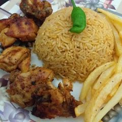 A picture of Smokey Chicken(BBQ in pan😍)with fried rice and fries.