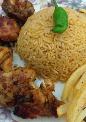 A picture of Smokey Chicken(BBQ in pan😍)with fried rice and fries.