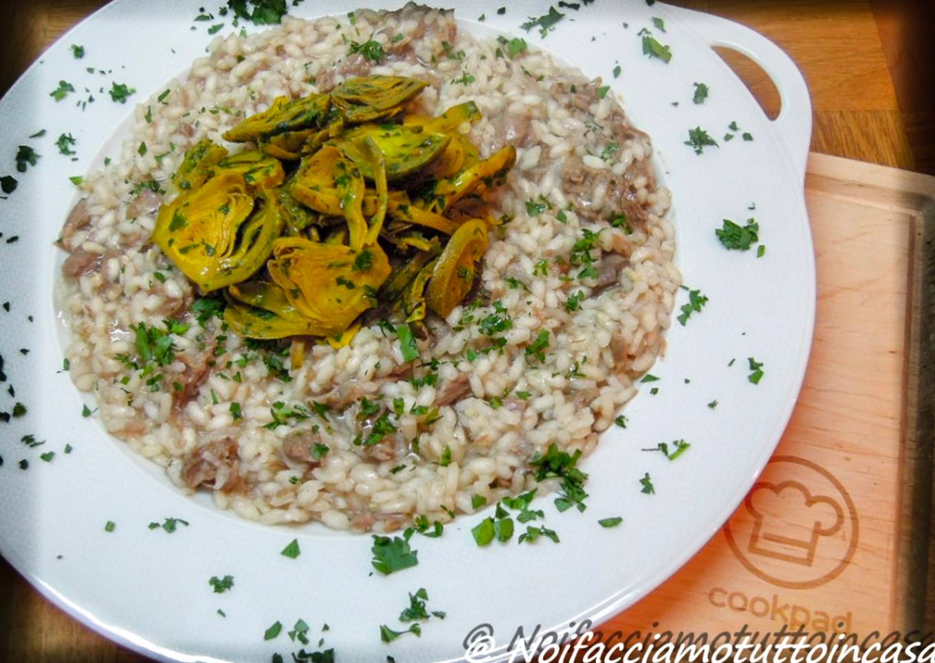 Boiled lamb risotto and baby broth with fried artichokes and turmeric