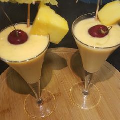 A picture of Mango and cherry drink.