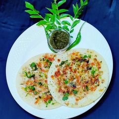 A picture of Onion and Tomato Uttapam.