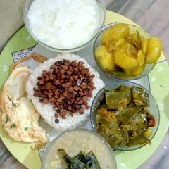 A picture of Rice, lentil fry,dal,sim jhal,aloo cuarri,egg fry,dhoy.