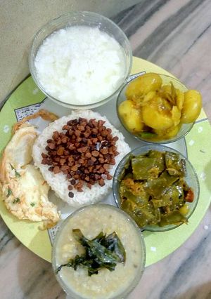 A picture of Rice, lentil fry,dal,sim jhal,aloo cuarri,egg fry,dhoy.