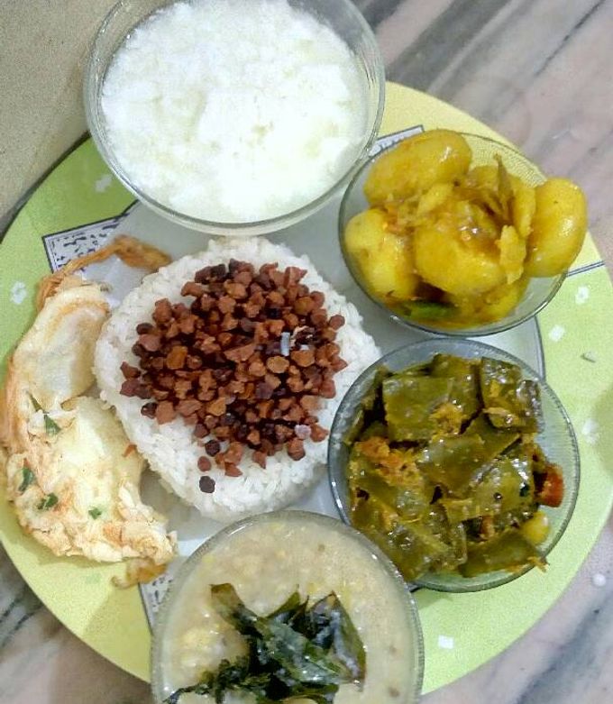 A picture of Rice, lentil fry,dal,sim jhal,aloo cuarri,egg fry,dhoy.