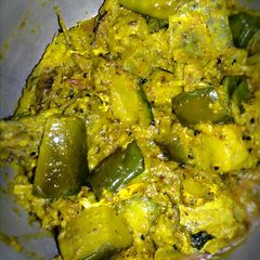 A picture of Brinjal hilsha fish stir fry.