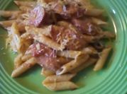 Una foto de penne con queso