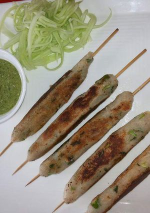 A picture of Shakarkand seekh kebabs.