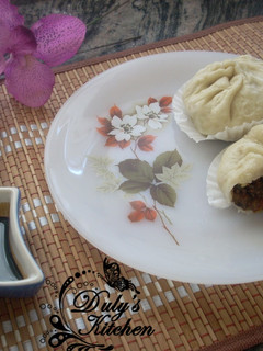 Una foto de Bollos rellenos al vapor o Baozi