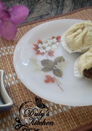 Una foto de Bollos rellenos al vapor o Baozi