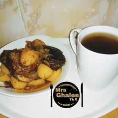 Irish potatoes poriddge with smooked fish and black tea A picture of Irish potatoes poriddge with smooked fish and black tea.