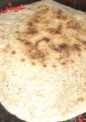 A picture of Baladi Bread on a Sieve 🥰.