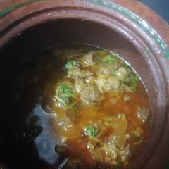 A picture of Mutton Handi made in clay pot.