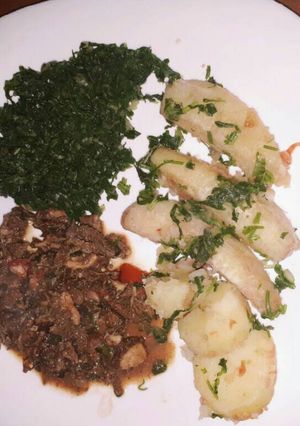 A picture of Plantain served with spinach and tripes.