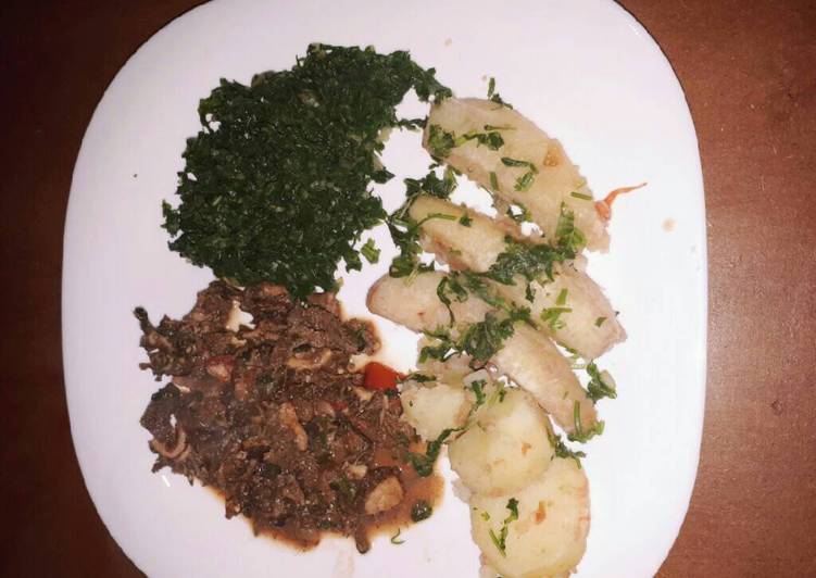 Plantain served with spinach and tripes