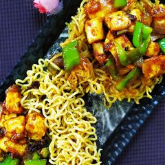 A picture of Noodles basket with chilli paneer.
