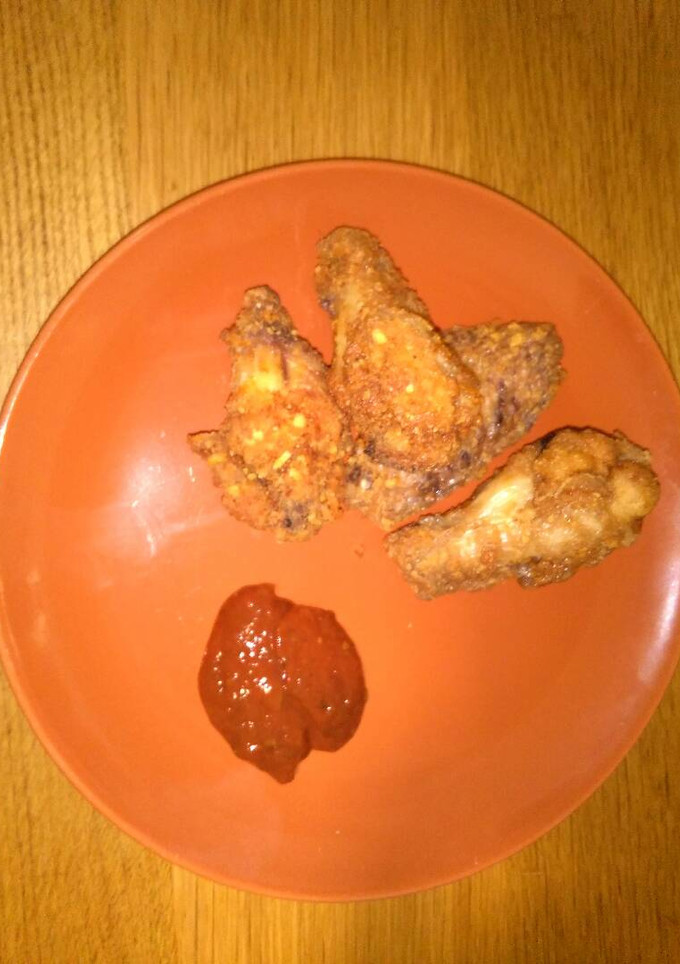 Una foto de Alitas de pollo en rebozado y salsa picante
