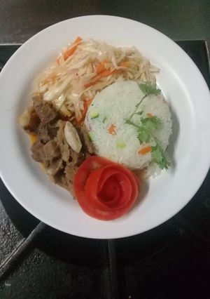 A picture of Steamed vegetable rice, fried beef stew n steamed cabbages.