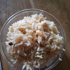 A picture of Narali bhat (coconut rice).