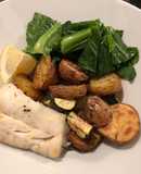 Baked Cod, potatoes and courgette with winter greens