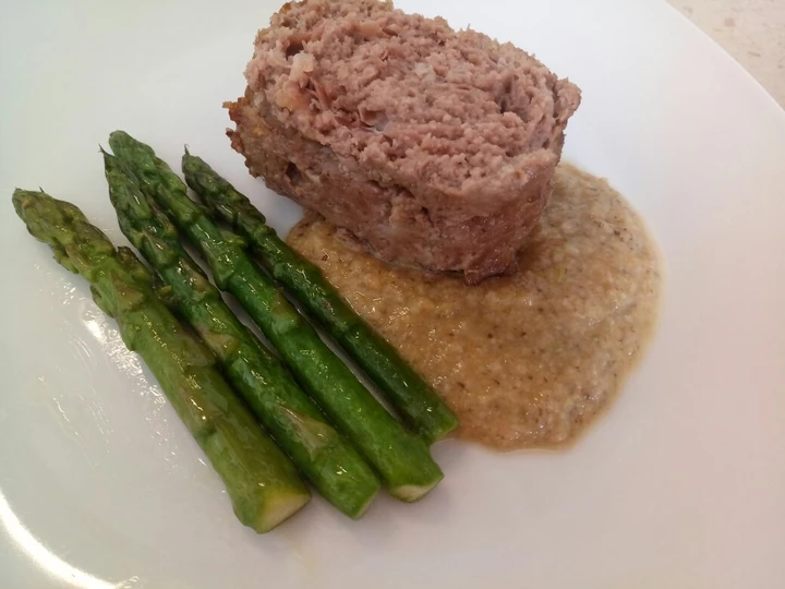 Easy Steps to Prepare Meatloaf with prosciutto, porcini sauce and pan fried asparagus the Delicious Tasty