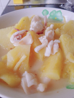 A picture of Fresh pineapple and squid.