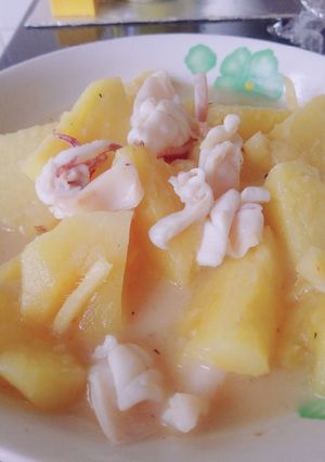 A picture of Fresh pineapple and squid.