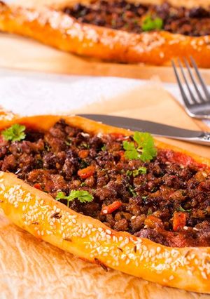A picture of Lahm Bi Ajeen with Vegetables (Middle Eastern Meat Pies).