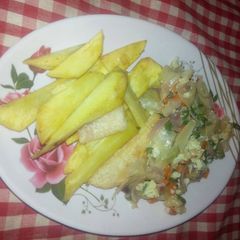A picture of Fried sweet potatoes with egg sauce.