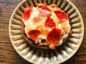 A picture of pizza with marinara