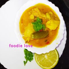 A picture of Mixed dal chicken sambar.
