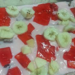 A picture of Cake and fruit custard.