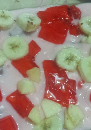 A picture of Cake and fruit custard.