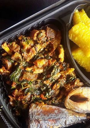 A picture of Boil plantain,fried fish and vegetable sauce.